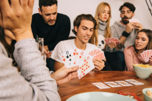 : A group of employees playing a casino game
