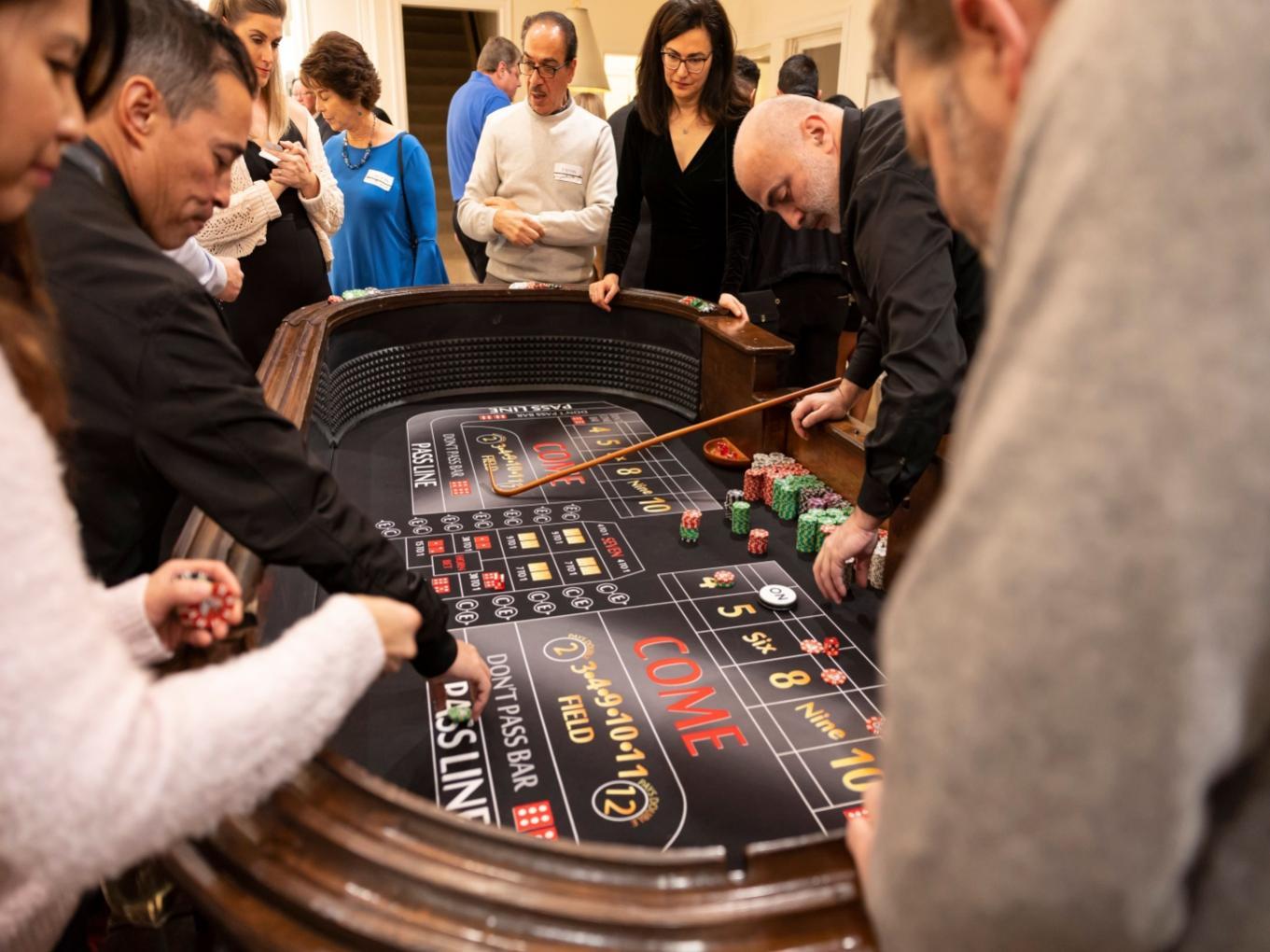 Guests playing craps at a brand event.