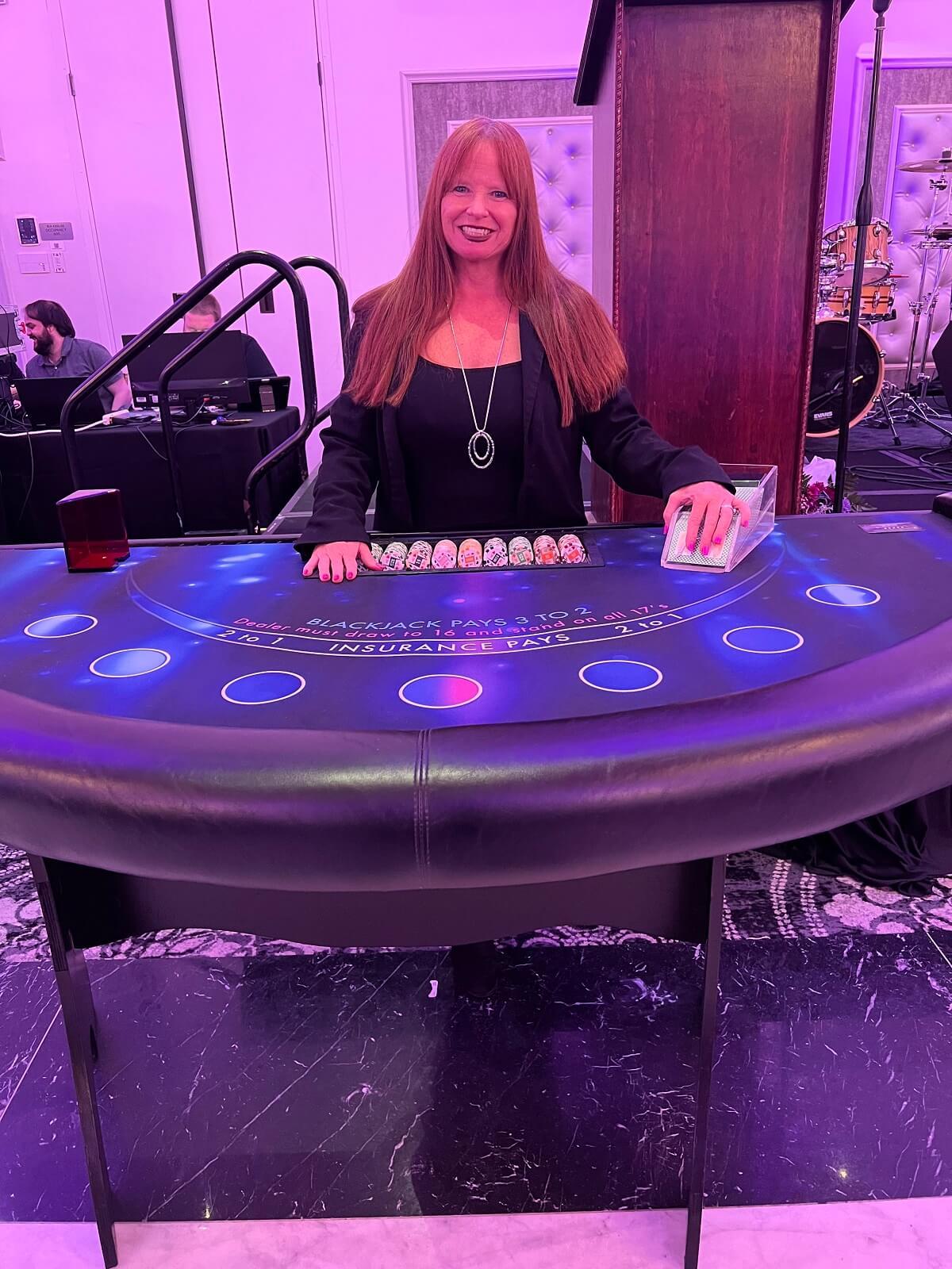Casino dealer at a roulette table during an event
