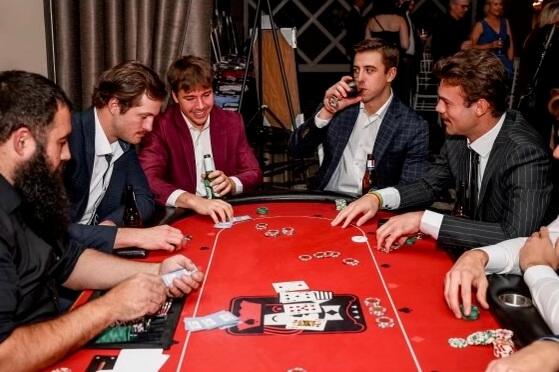 Guests enjoy a game of craps at a brand event.